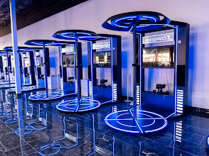 Odyssey VR virtual reality stations with blue lighting, showcasing advanced gaming technology for immersive experiences in Corona, California.